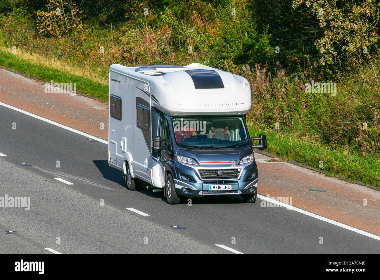 2016 Fiat Auto Trail Apache 700; UK Vehicular traffic, transport, modern vehicles, saloon cars, south-bound on the 3 lane M6 motorway highway. Stock Photo