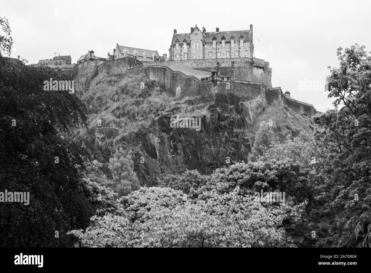 Black and white image of Edinburgh Castle historic fortress dominating the skyline of the city