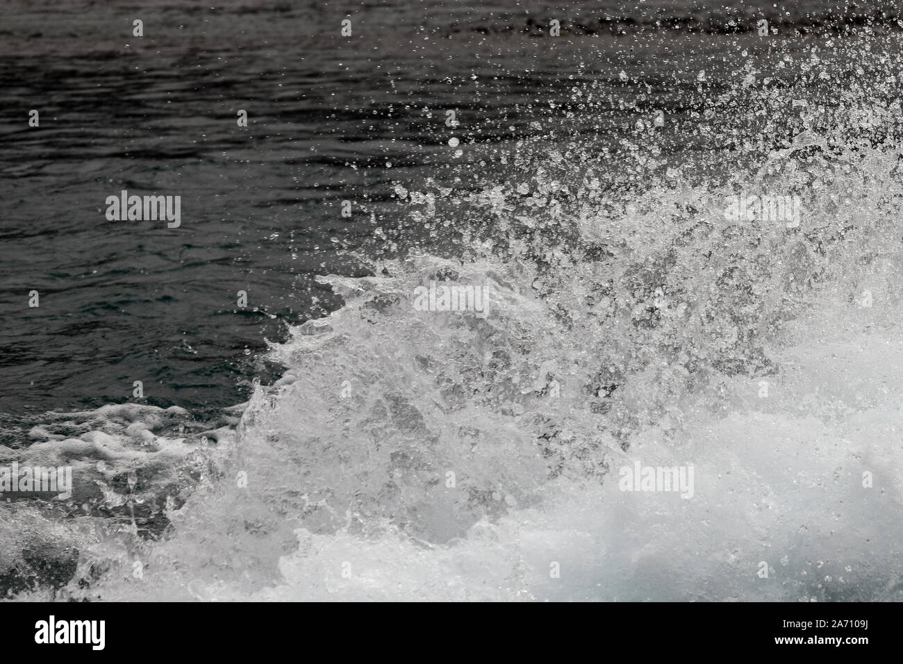 background of a spray of water and water droplets left in the wake of a jet boat Stock Photo