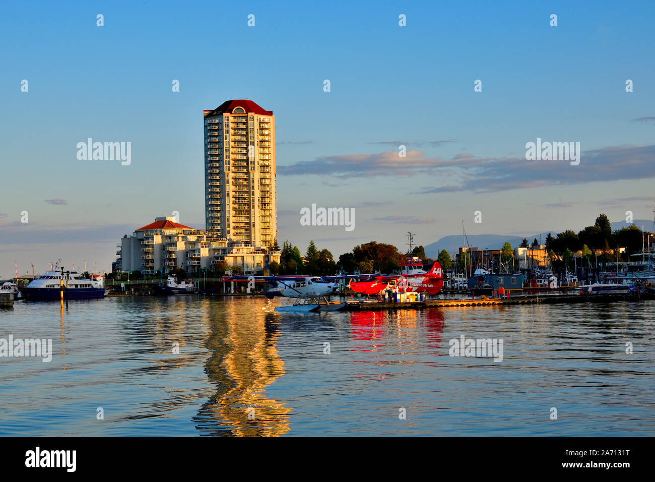 A landscape view in Nanaimo harbour with the airplane dock and tall condo buildings in the background Stock Photo