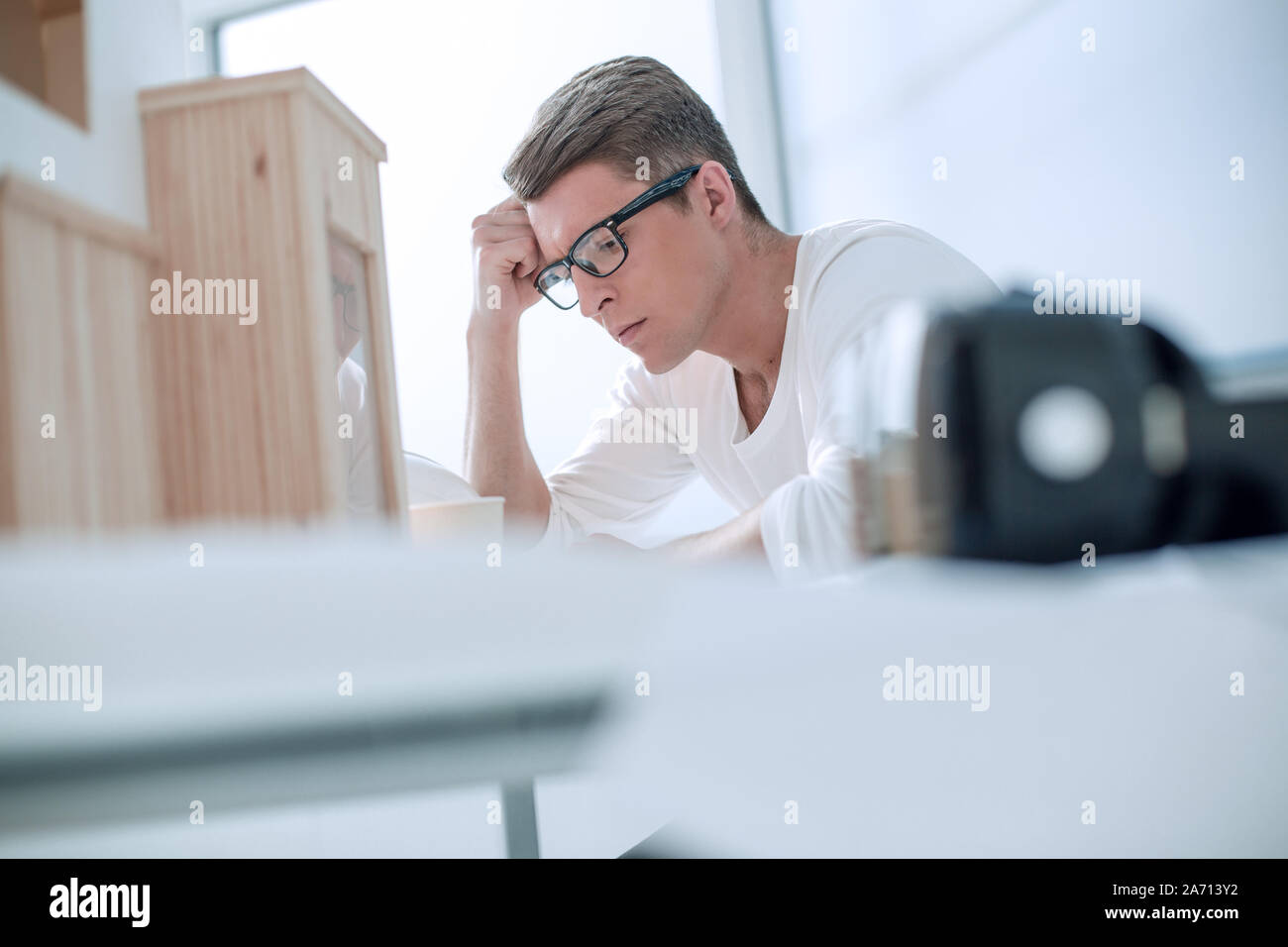 serious young designer pondering ideas for a new project Stock Photo