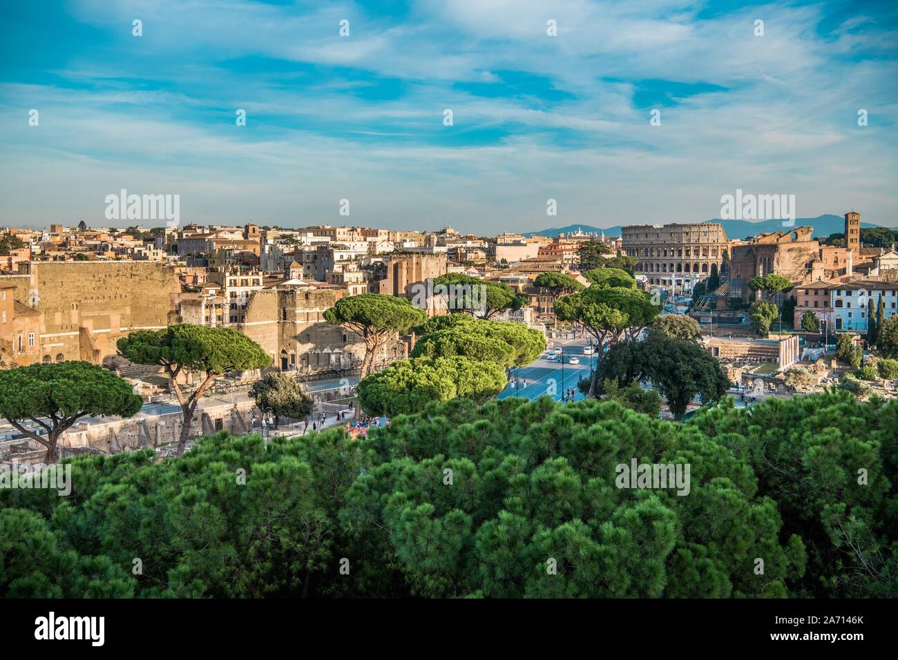 City of Rome Panorama with Colosseum and Roman Forum and Market. Clear Blue Sky with Some Small Clouds. Capitol of the Lazio Region. Stock Photo