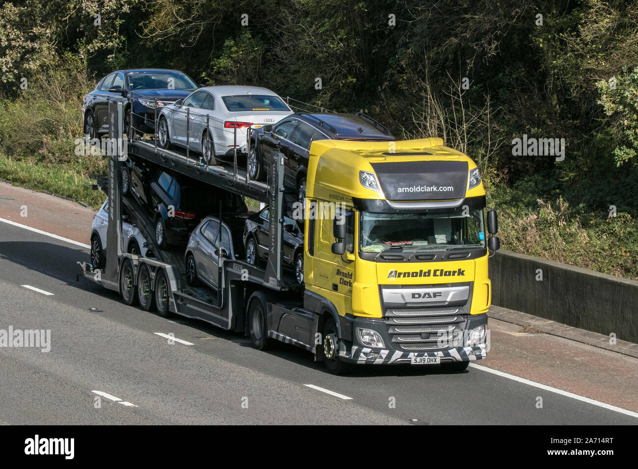 DAF Arnold Clark car carrier commercial transport, industry, on the M6 at Lancaster, UK Stock Photo