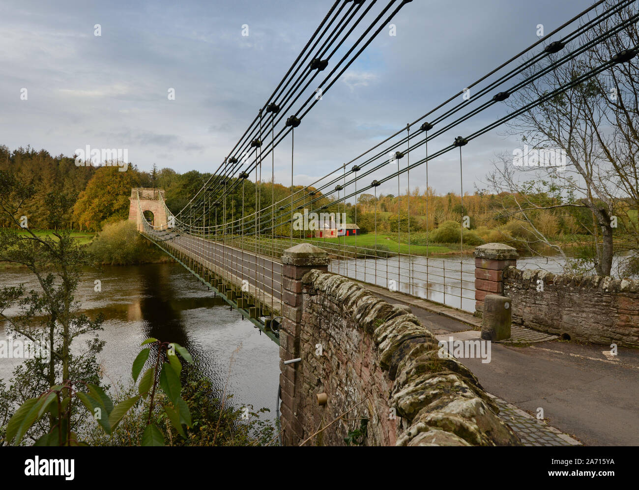 The Union Chain Bridge the oldest suspension bridge carrying traffic crossing the River Tweed and the English Scottish border. Stock Photo