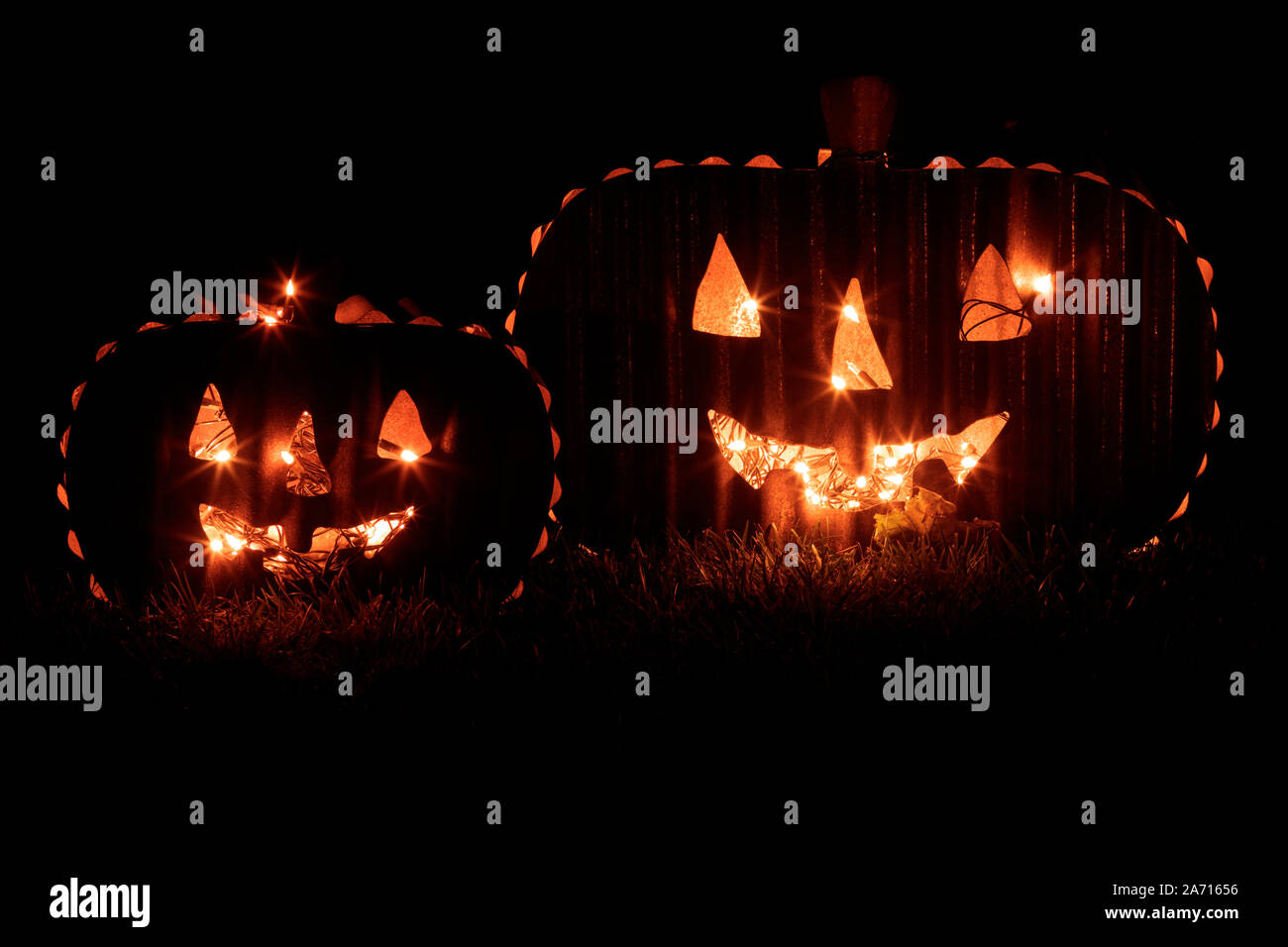 Two Jack O Lanterns Glowing in the Dark Stock Photo