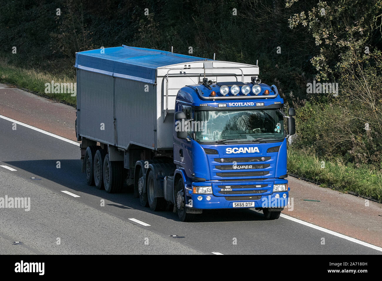 Scania Super G450 Haulage delivery trucks, lorry, transportation, truck, cargo, vehicle, delivery, commercial transport, industry, on the M6 Stock Photo