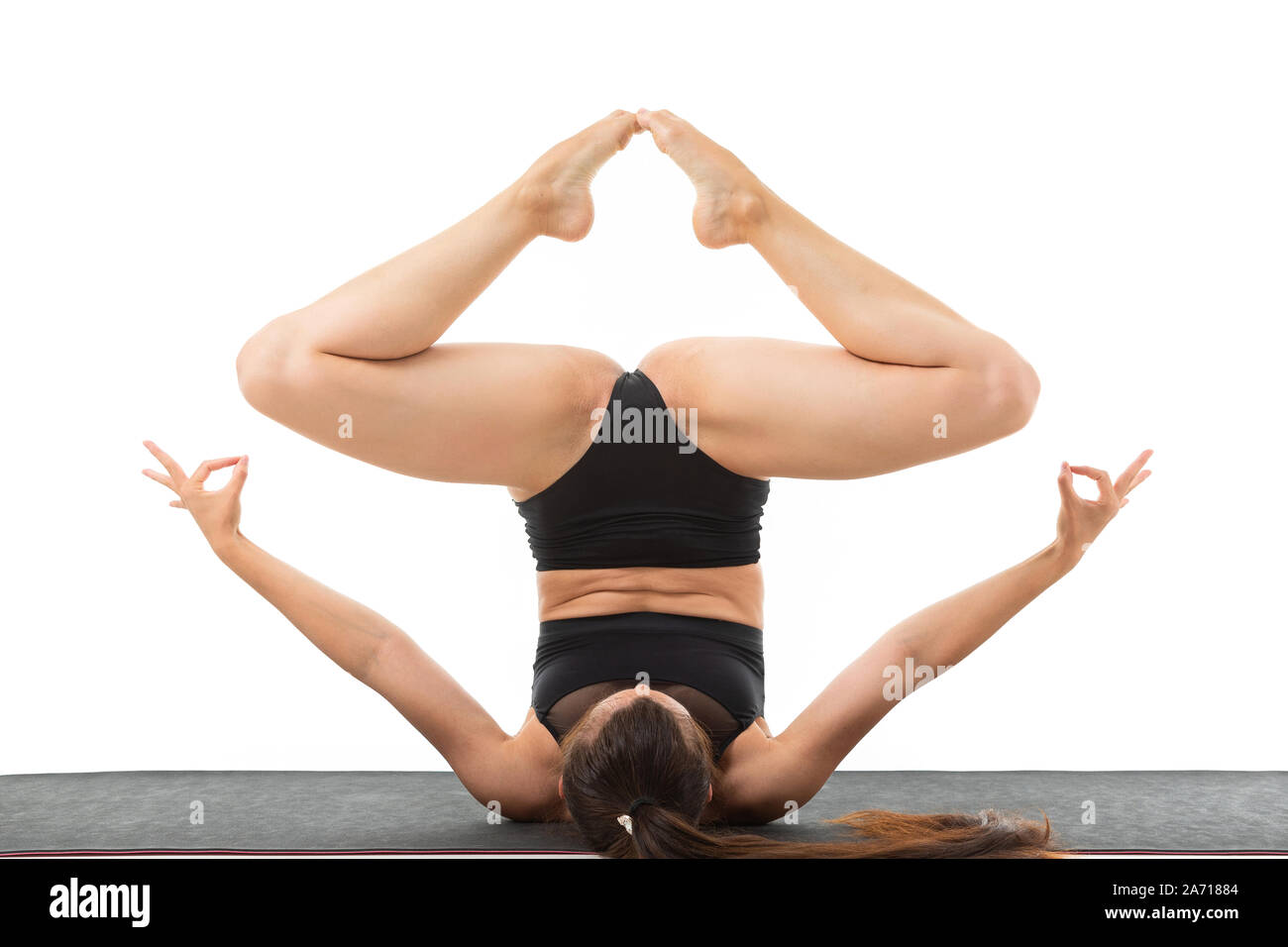 beautiful flexible woman doing yoga poses on white background