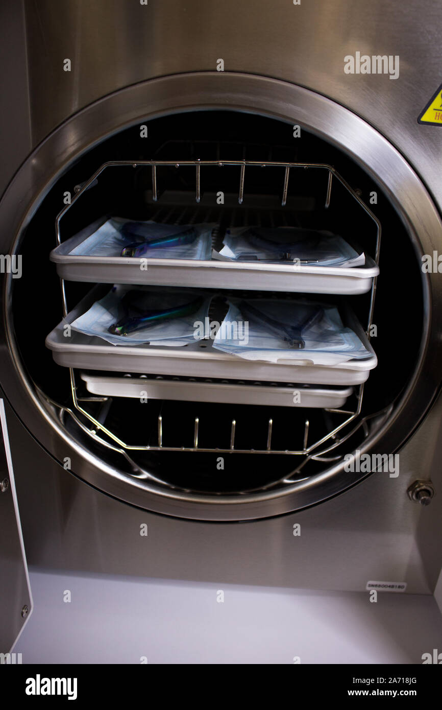 Sterilizing medical instruments in autoclave. Equipment for sterile cleaning of working medical