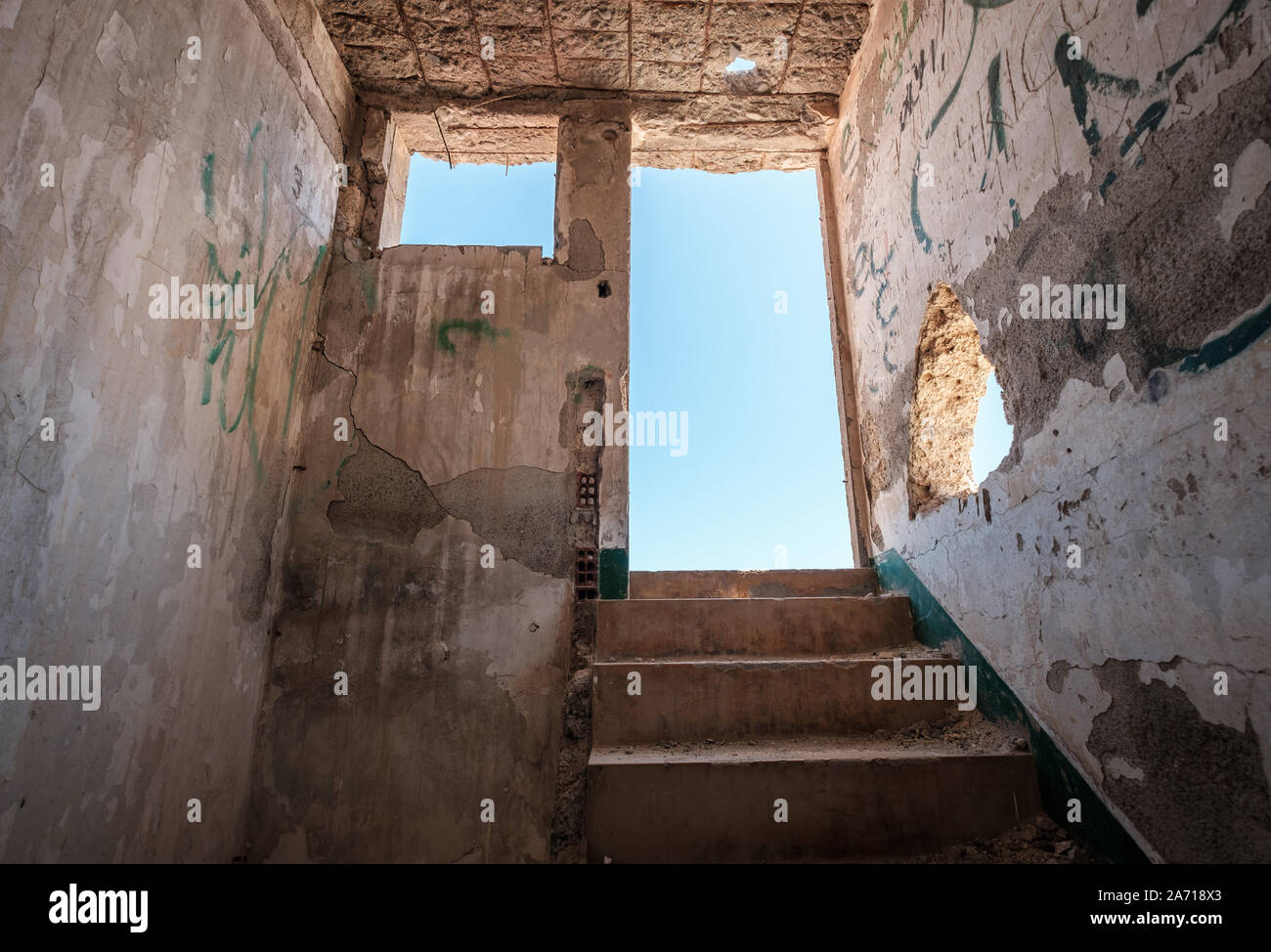 stairs and exit of run down room in abandoned building ruin - way out - Stock Photo