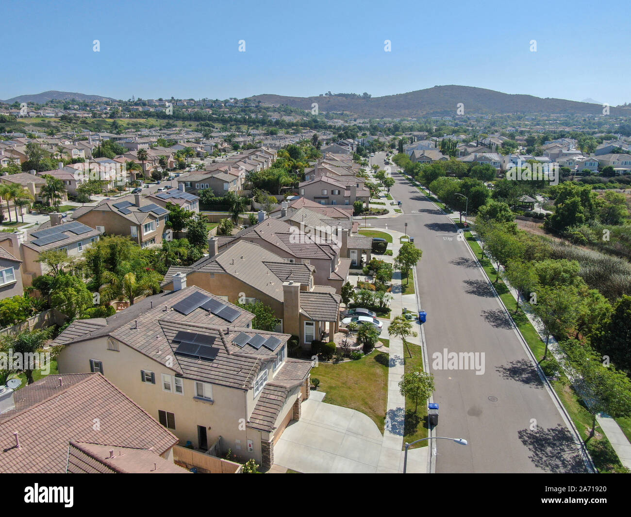 Suburban neighborhood street with big villas next to each other in