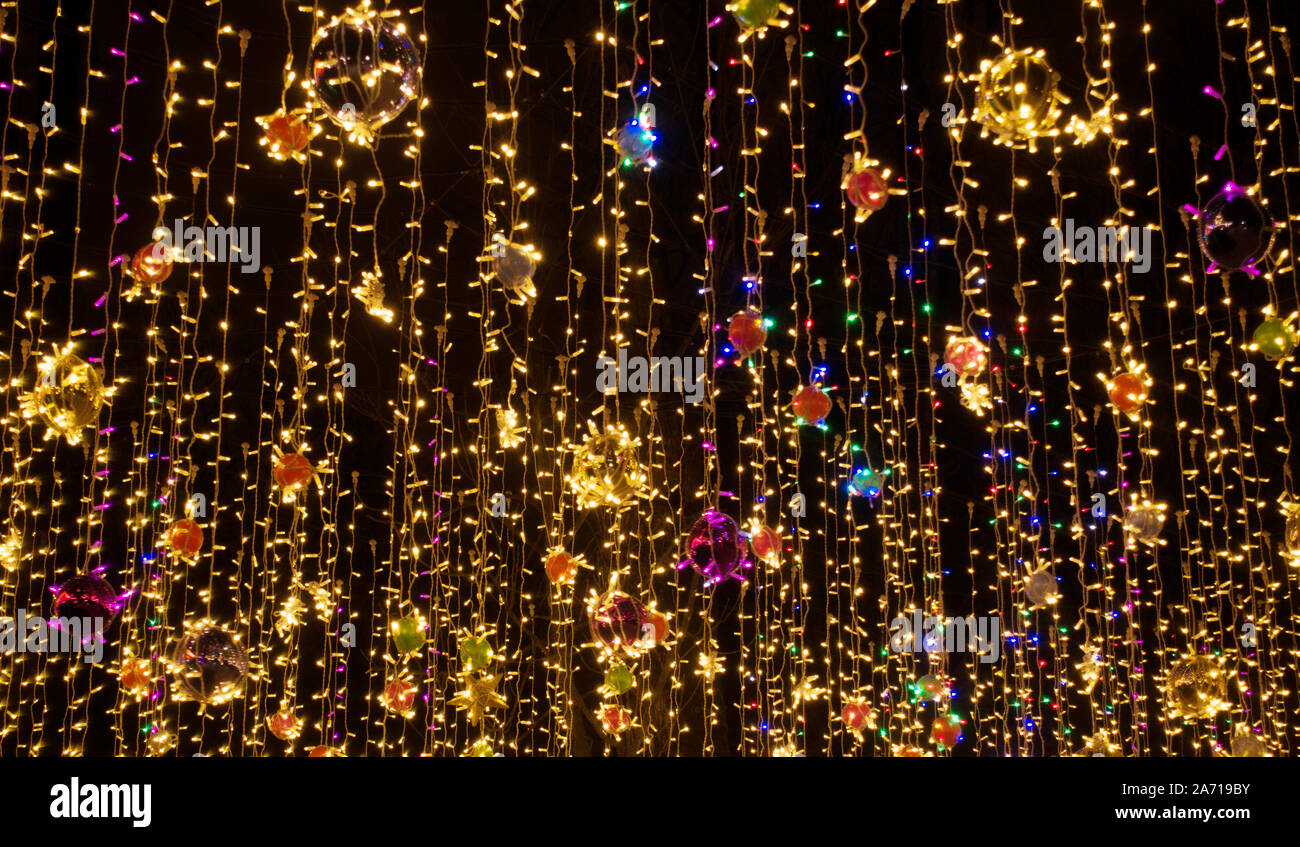 Beautiful colorful holidays garland. Christmas or New Year holidays colorful background. Stock Photo