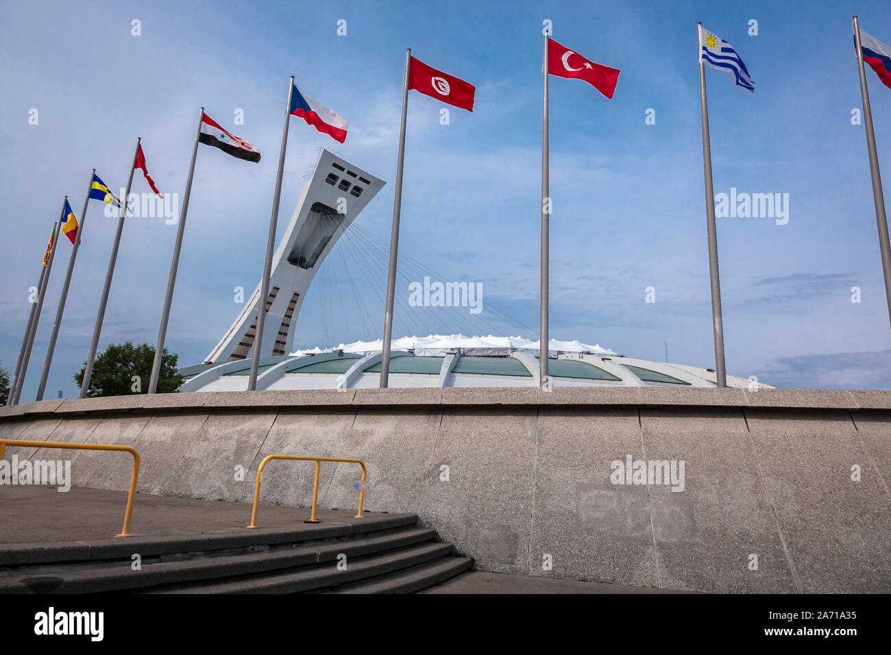 Olympic stadium of Montreal with participating nations flags, July 06, 2012  Quebec, Canada - Stadium was opened in 1976 for the Summer olympics Stock Photo