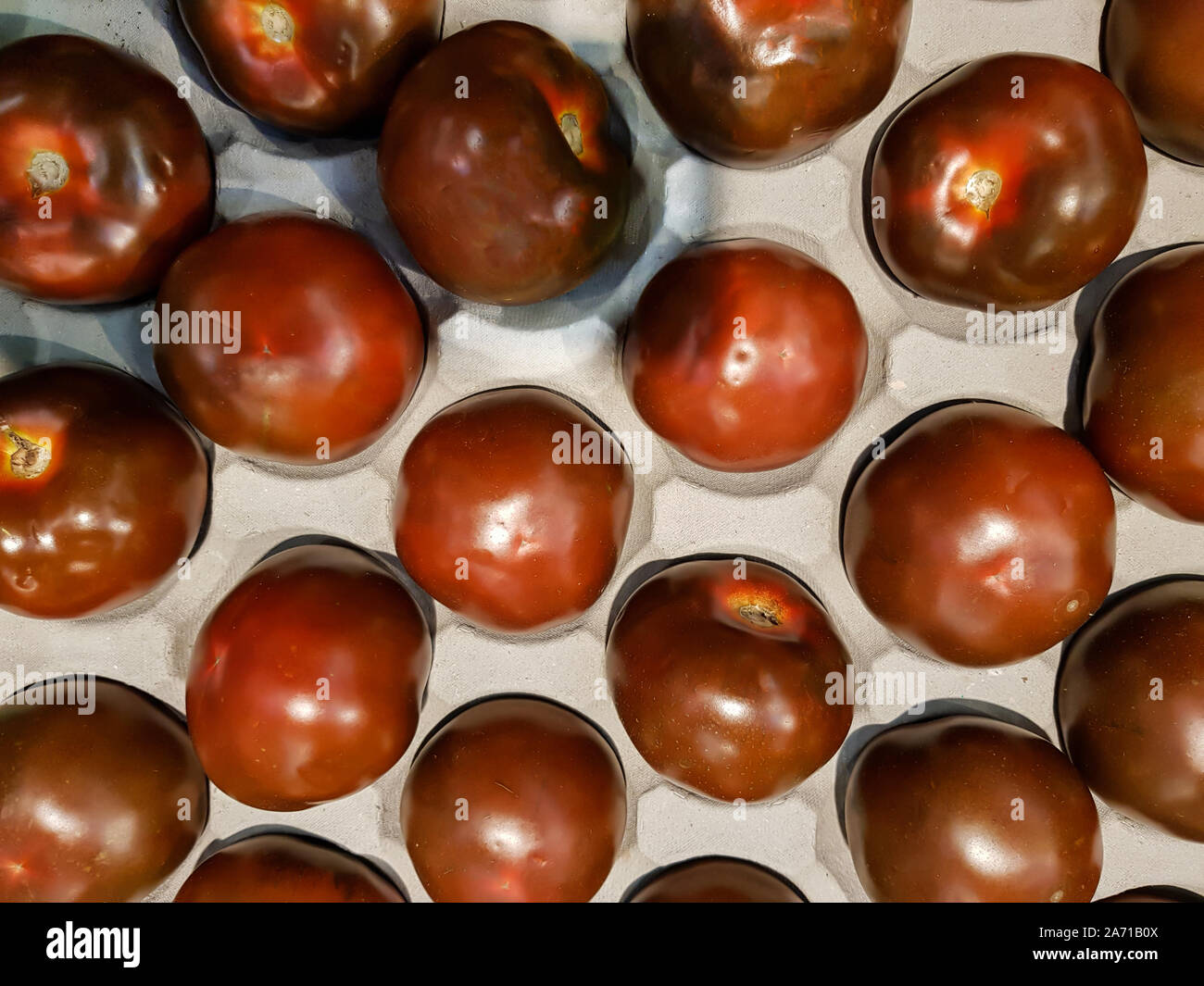 Top view of Kumato tomatoes Stock Photo Alamy