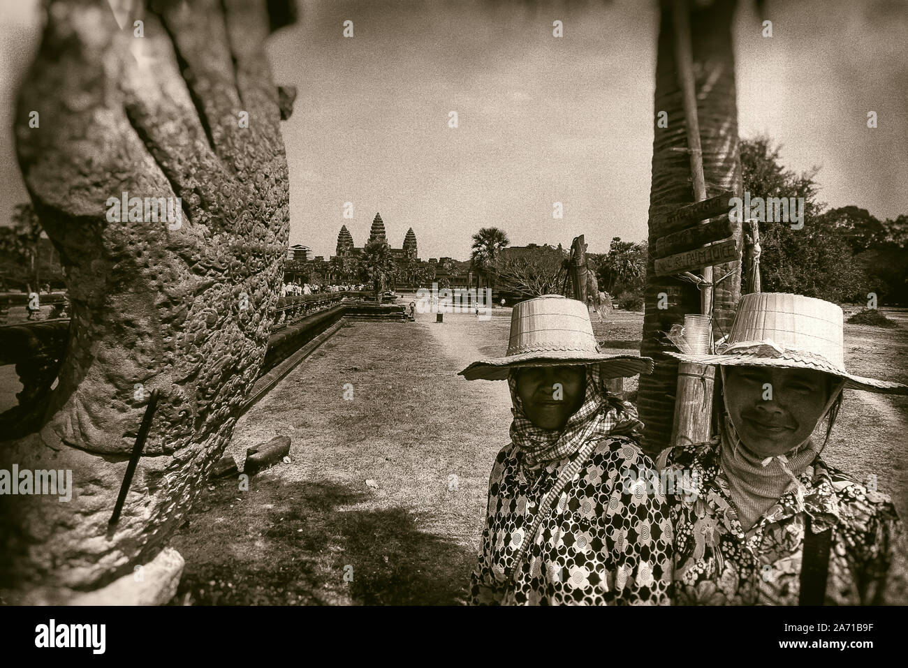 Cambodia, Angkor Wat: portrait of two women selling palm juice, along the driveway to Angkor Wat. Stock Photo