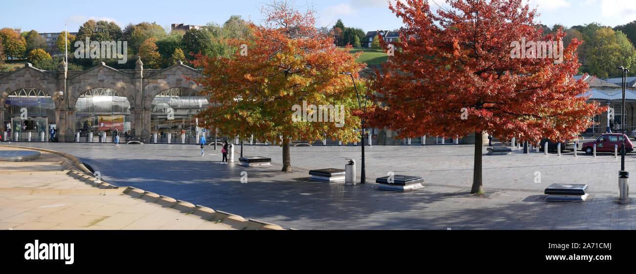 Trees in their autumn colours outside the railway station in Sheffield Yorkshire England Stock Photo