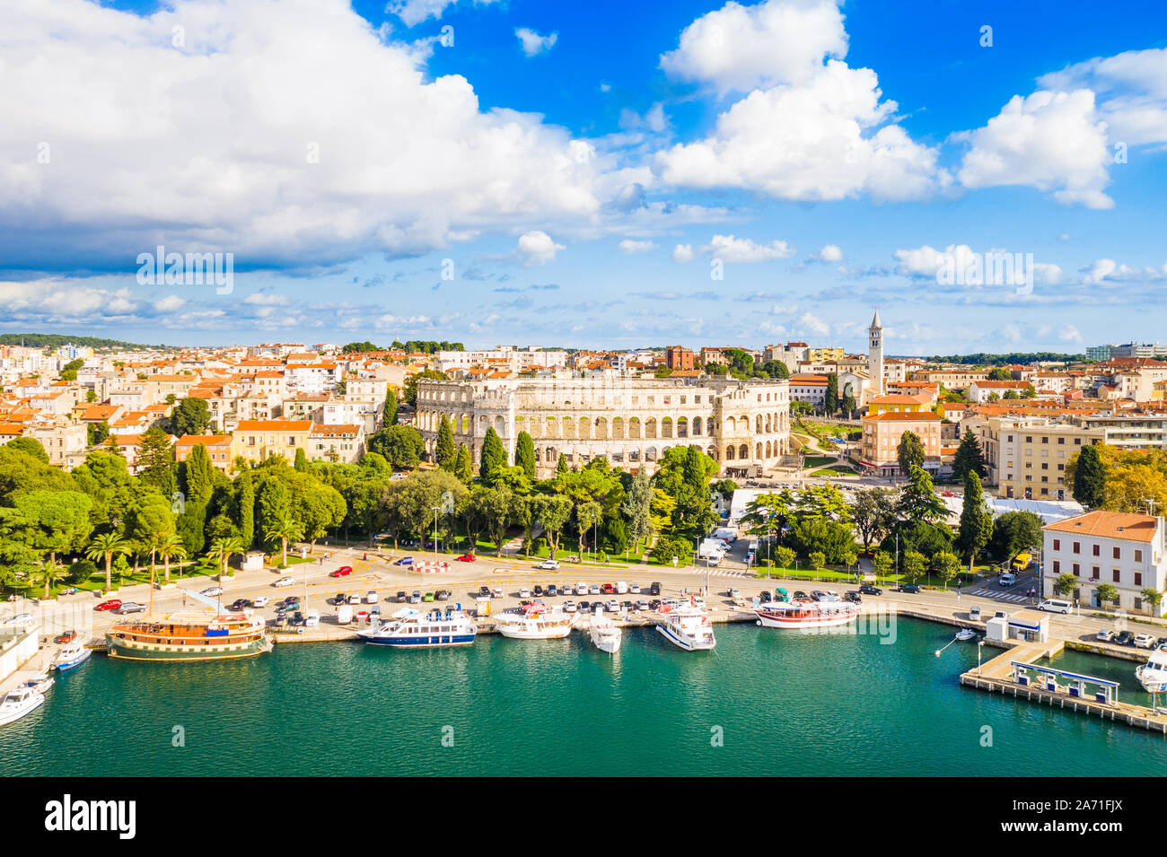 Croatia, city of Pula, ancient Roman arena, historic amphitheater and old town center from drone, aerial view Stock Photo