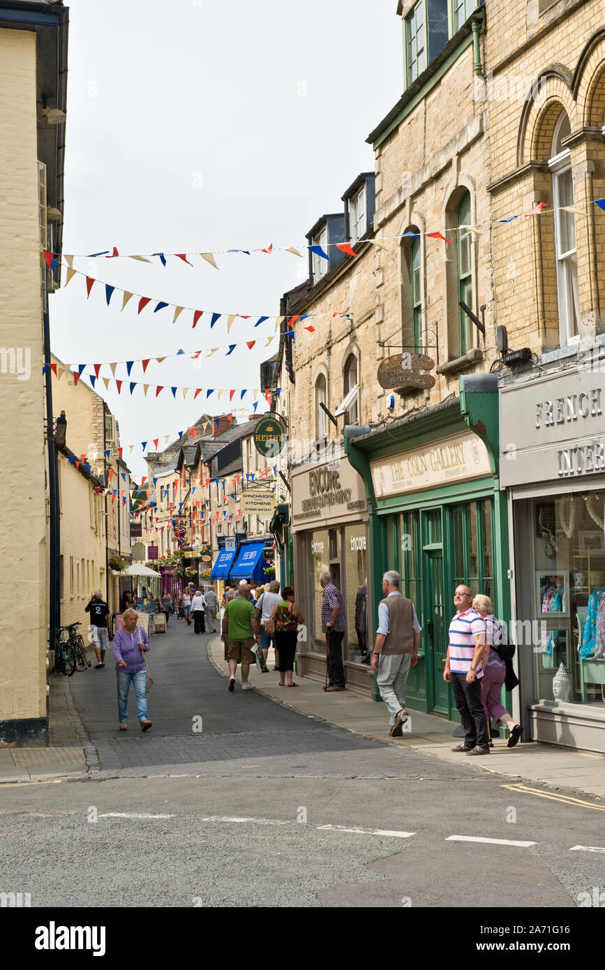 Busy shopping street in Cirencester market town. Gloucestershire, England Stock Photo