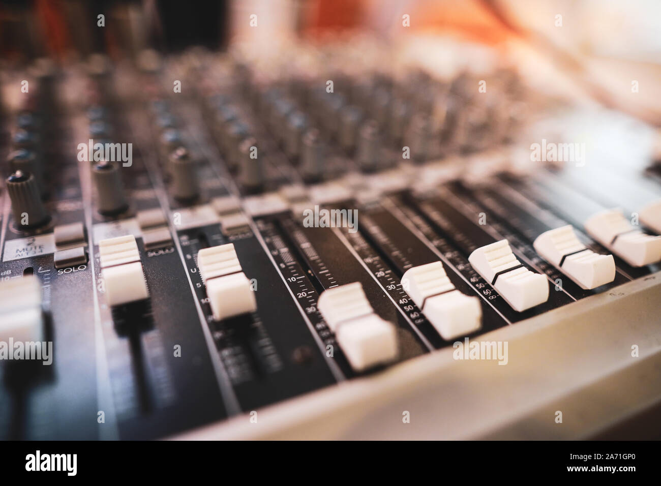 Shallow depth of field (selective focus) image with the controls on an audio mixer Stock Photo