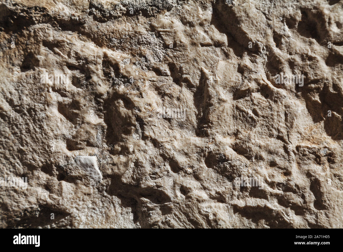 Rough stone texture with big details in harsh light Stock Photo - Alamy