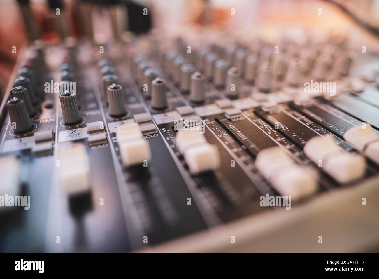 Shallow depth of field (selective focus) image with the controls on an audio mixer Stock Photo