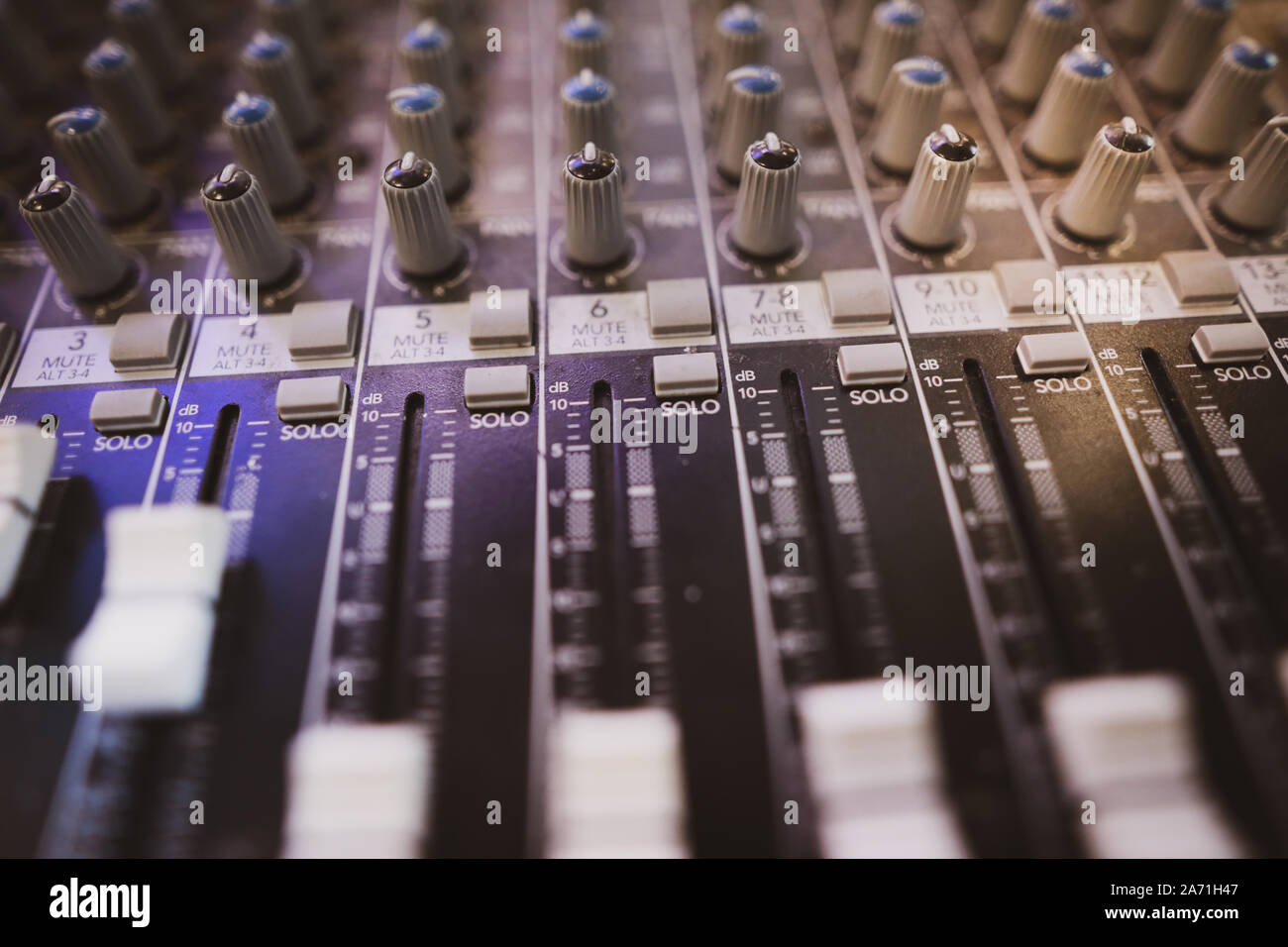 Shallow depth of field (selective focus) image with the controls on an audio mixer Stock Photo