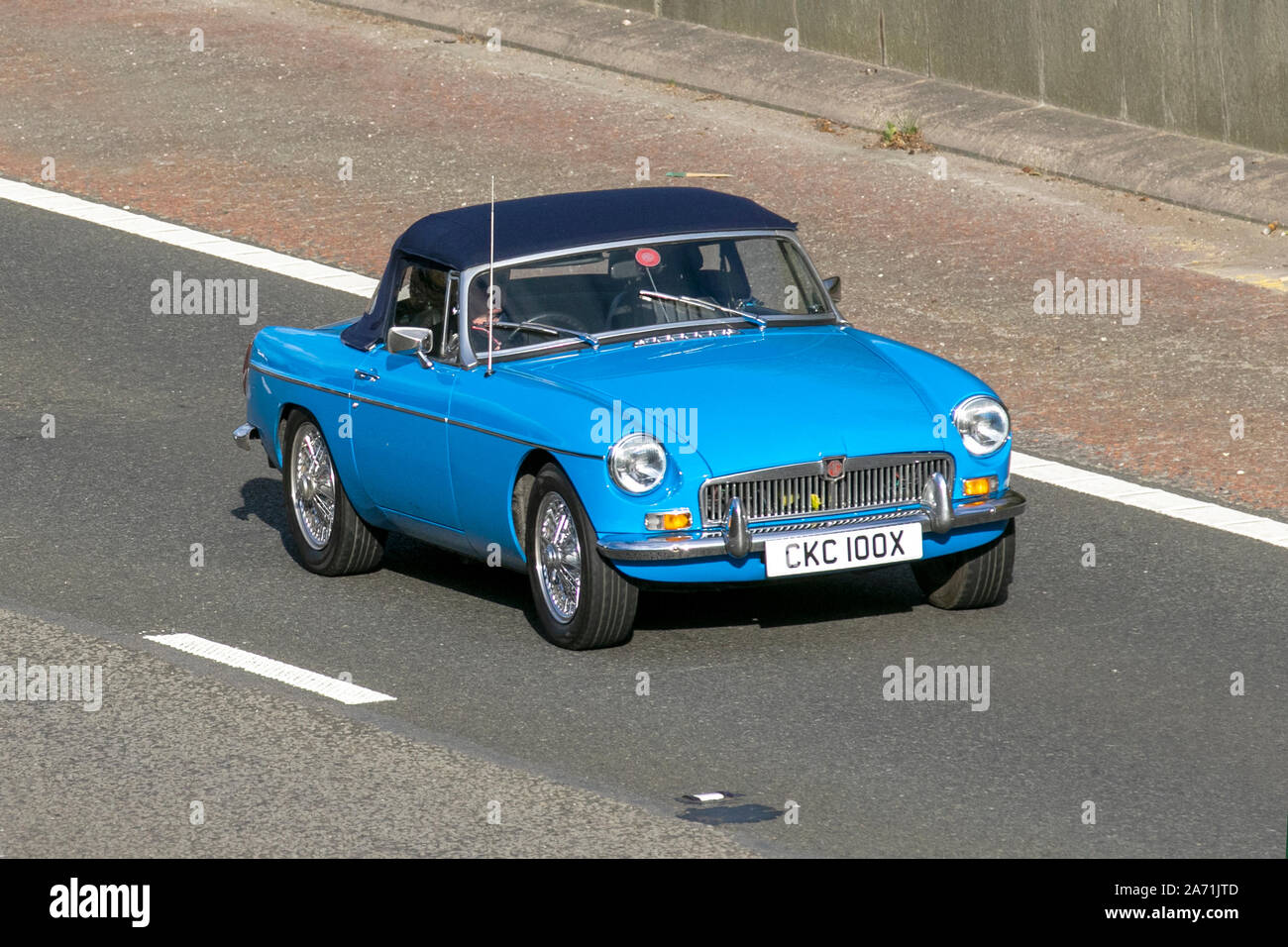 1982 blue MG B convertible soft top; UK Vehicular traffic, transport ...