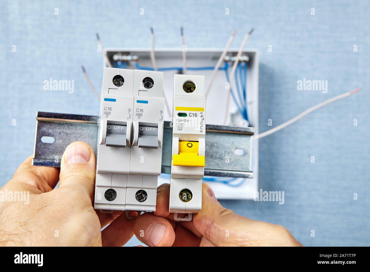 The automatic fuse Installing. In the event of overload or a short-circuit, miniature circuit breakers or  MCB safely cut the connected circuits and Stock Photo