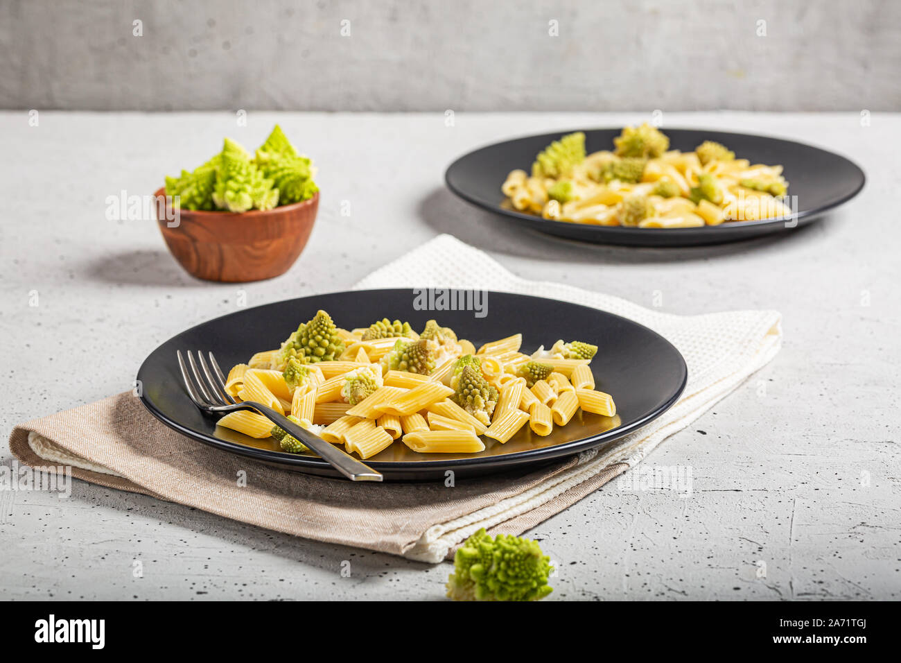 Penne pasta with romanesco cabbage on light gray background Stock Photo Alamy