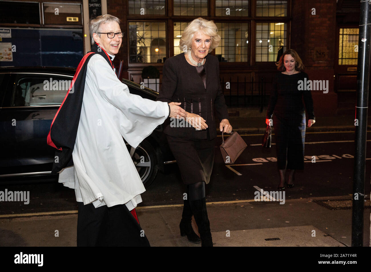 London, UK. 29th Oct, 2019. St Bride's Church, Fleet Street - Picture shows Camilla, Duchess of Cornwall greeted on arrival by The Reverend Canon Dr Alison Joyce at the Service of Remembrance Celebration to commemorate and support the journalists, photographers, camera-crew and support staff whose mission it is to bring us the news. Credit: Jeff Gilbert/Alamy Live News Stock Photo