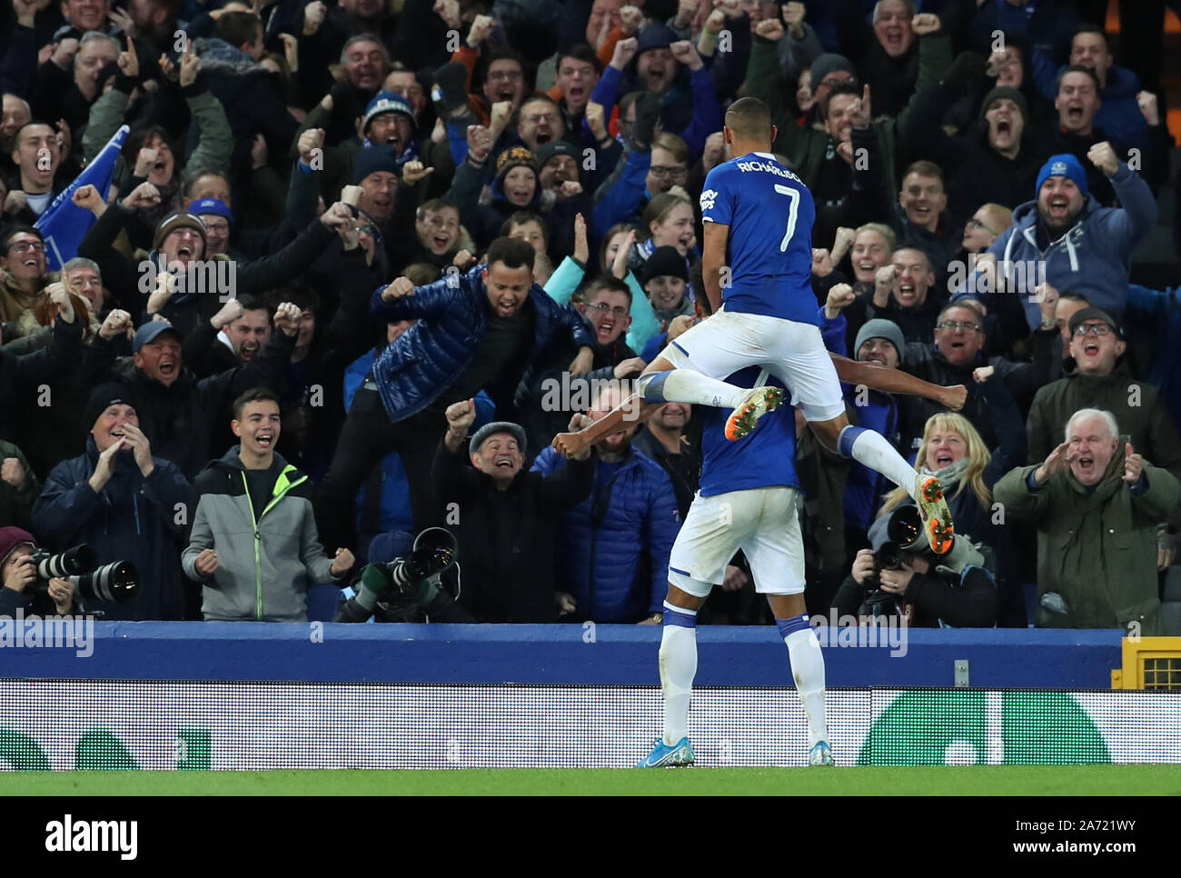 Goodison Park, Liverpool, Merseyside, UK. 29th Oct, 2019. English Football League Cup, Carabao Cup Football, Everton versus Watford; Mason Holgate of Everton celebrates with team mate Richarlison in front of supporters at the Gwladys Street end after scoring the opening goal after 72 minutes - Strictly Editorial Use Only. No use with unauthorized audio, video, data, fixture lists, club/league logos or 'live' services. Online in-match use limited to 120 images, no video emulation. No use in betting, games or single club/league/player publications Credit: Action Plus Sports/Alamy Live News Stock Photo
