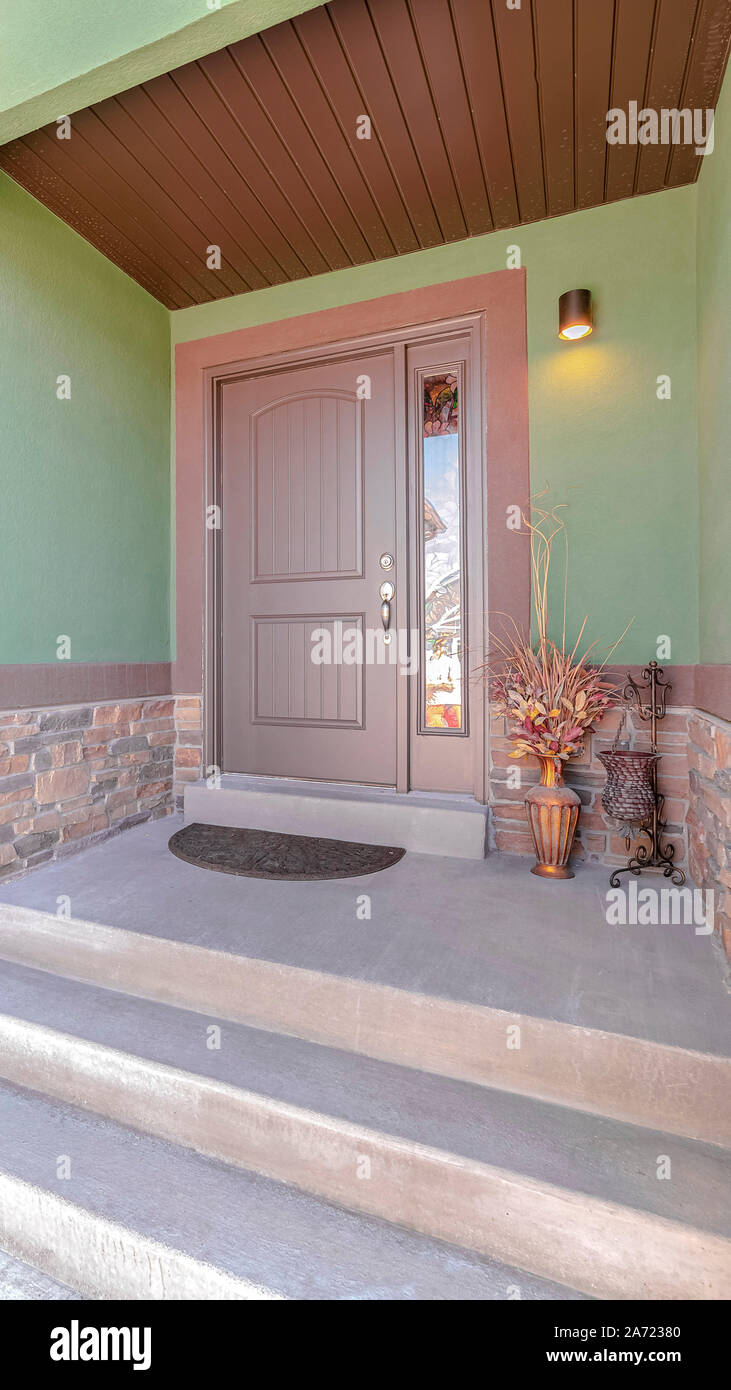 Vertical Front porch and door of traditional green home Stock Photo - Alamy