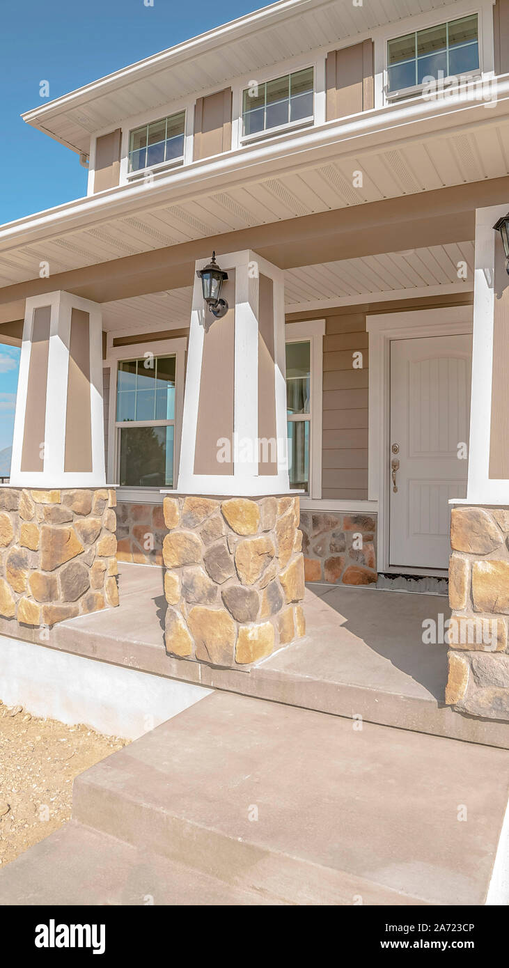Vertical Front porch and door of new two storey home Stock Photo - Alamy