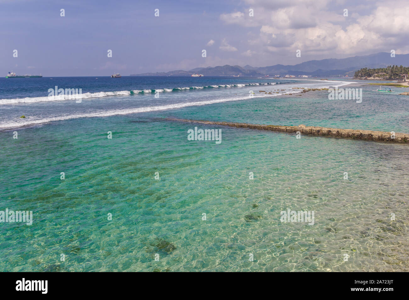 Turquoise water of the Candidasa coast on Bali, Indonesia Stock Photo