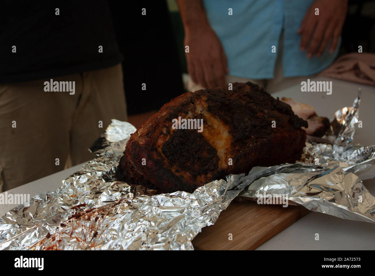 Meat on aluminum foil with the name of Brisket ready for eat Stock
