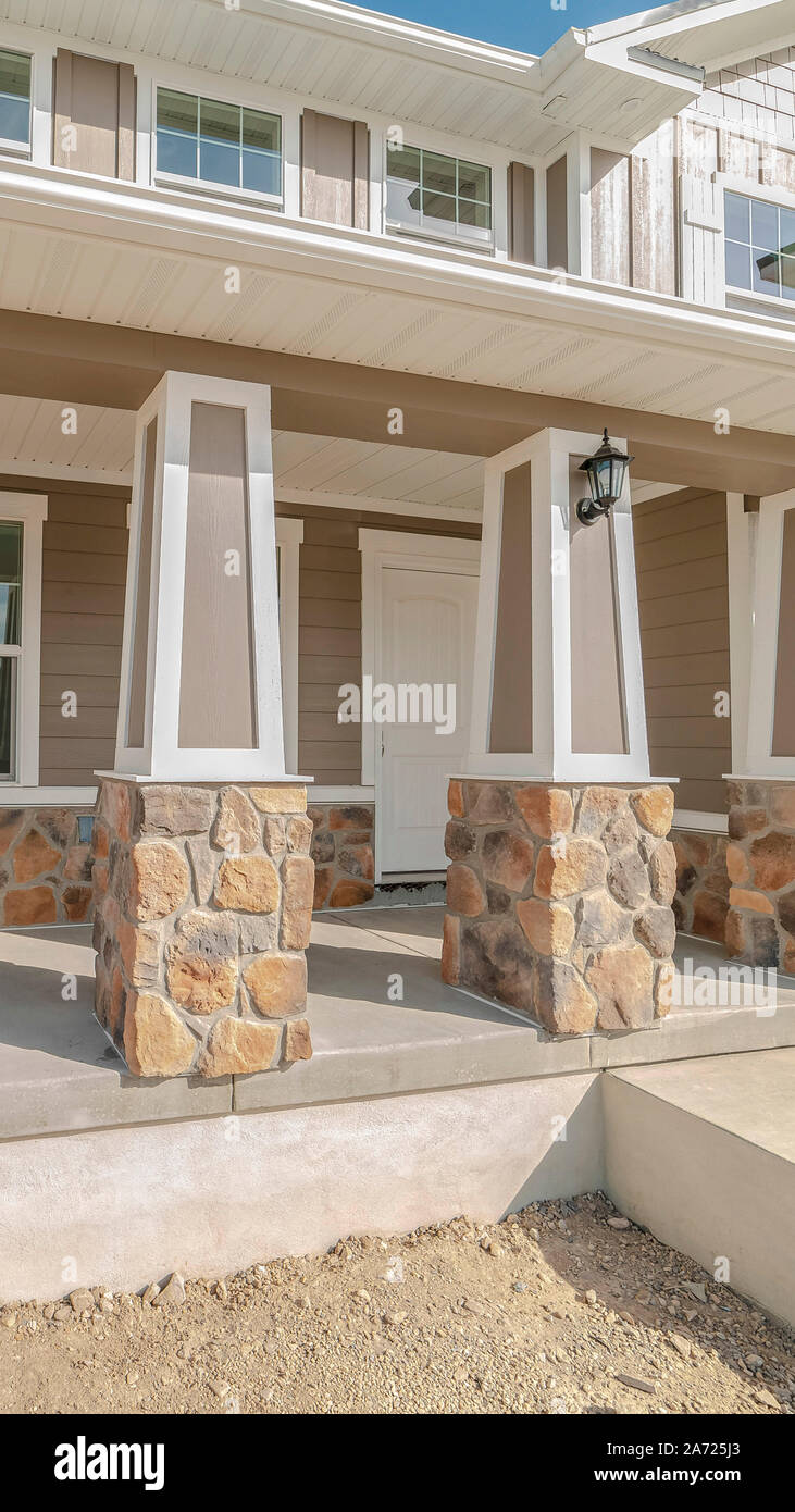 Vertical frame Front porch and door of new traditional home Stock Photo ...