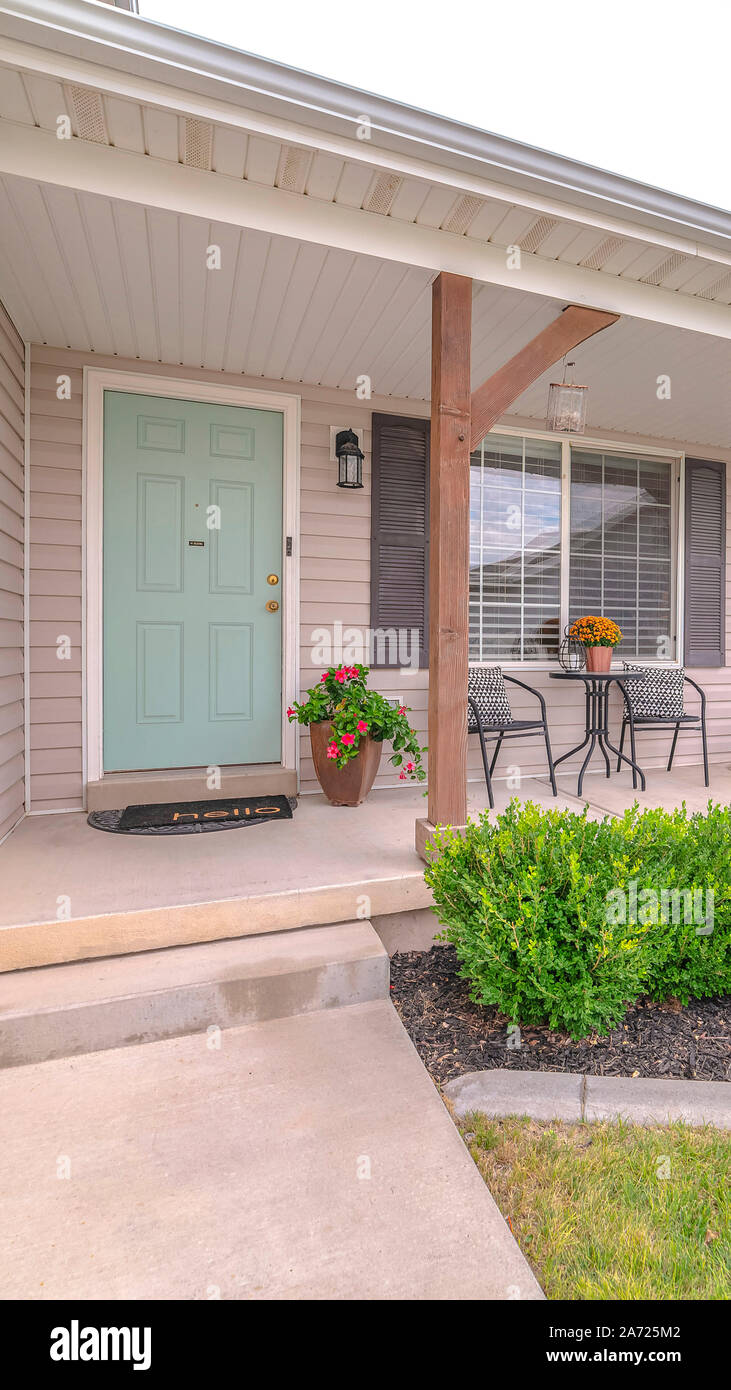 Vertical Front porch of modern home with landscaped garden Stock Photo ...