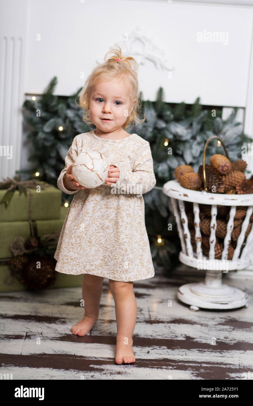 Cute little girl with blonde hair decorating christmas tree Stock Photo - Alamy Cute little girl with blonde hair decorating christmas tree Stock Photo - Alamy