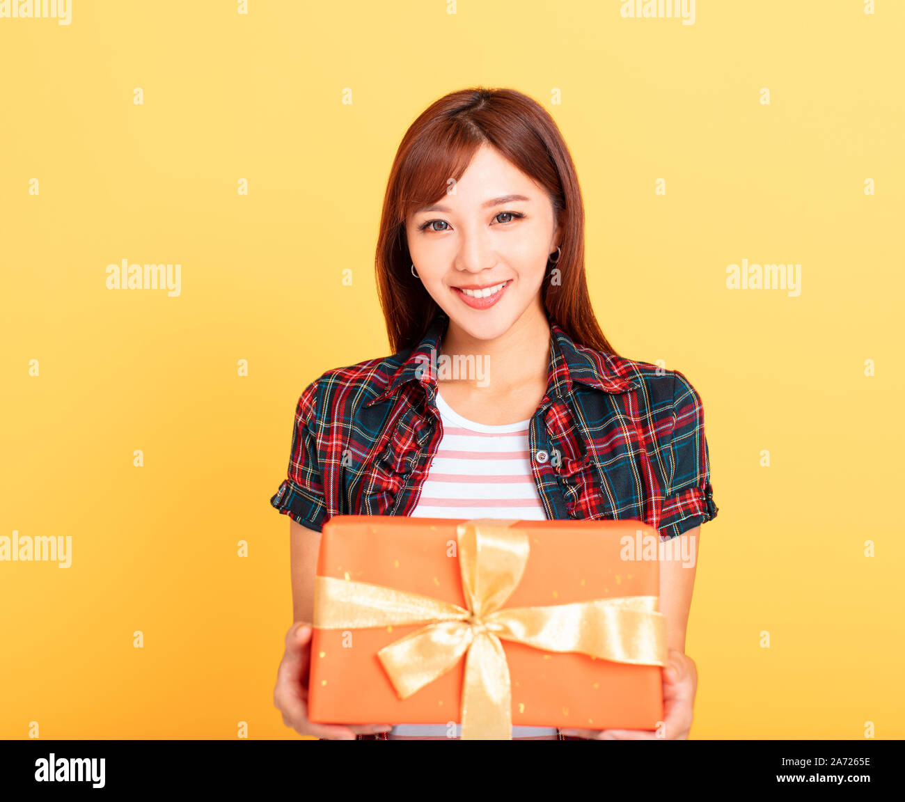 Happy young asian woman  holding gift box Stock Photo