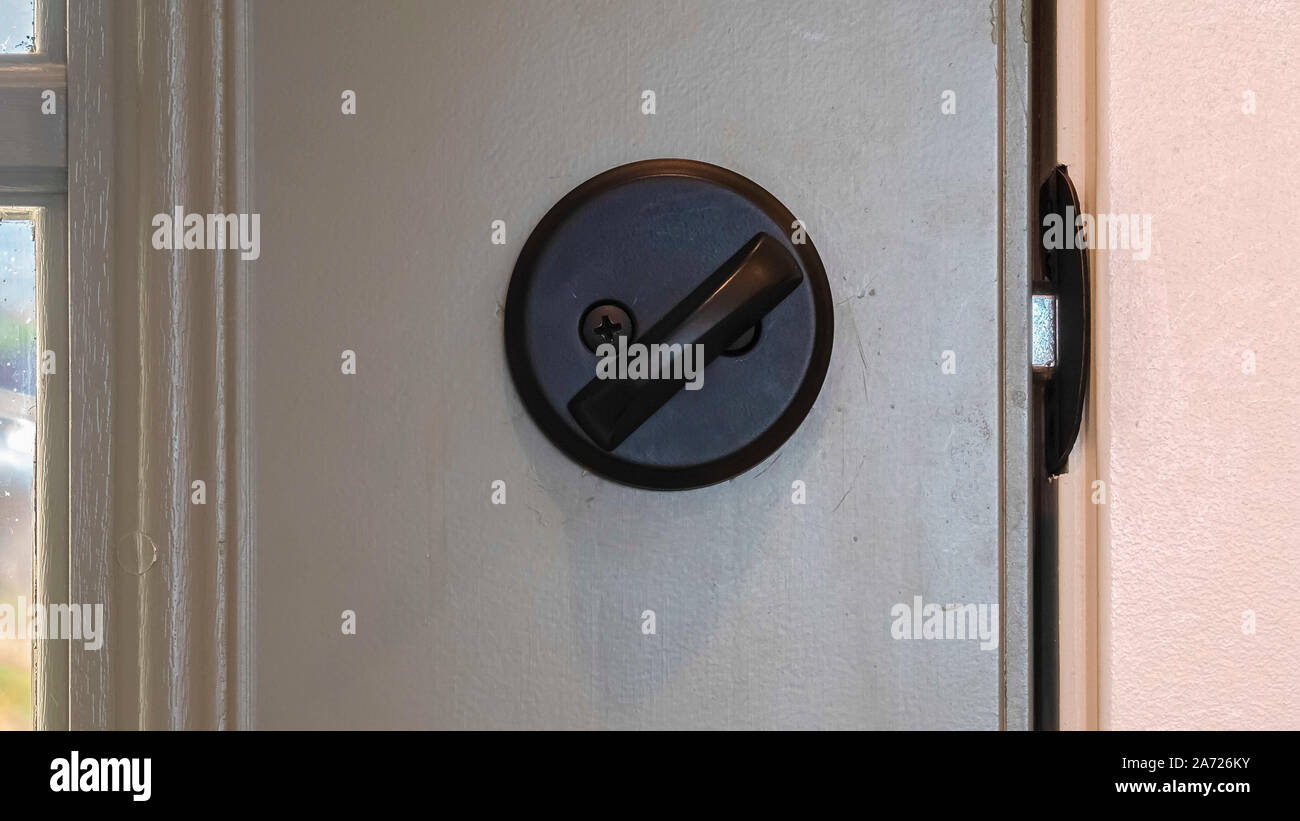 Panorama Frame Close Up Of Black Door Knob And Locked Latch Stock