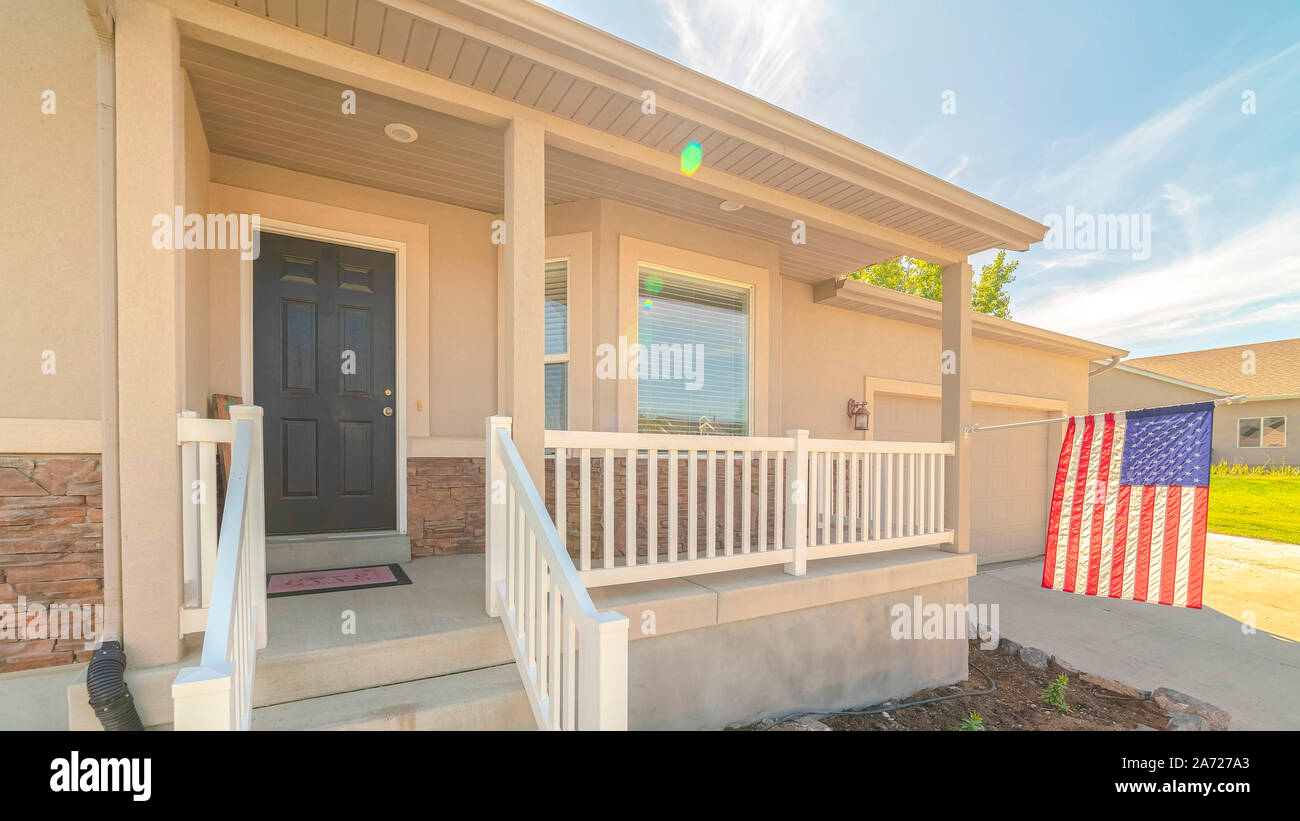 Panorama frame Front porch of suburban home with American flag Stock ...