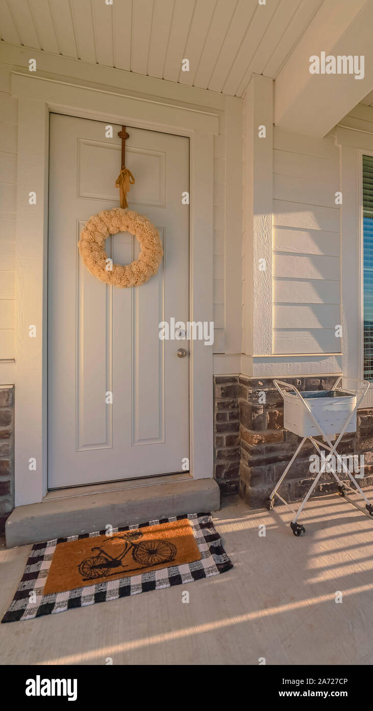 Vertical frame Front porch of modern home with swinging chair Stock ...