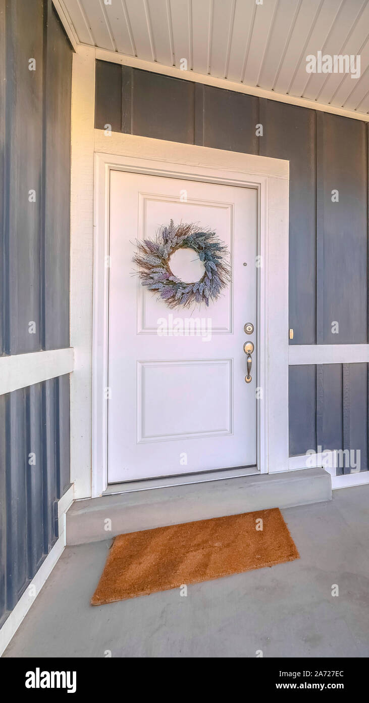 Vertical Front door and porch area of modern suburban home Stock Photo ...