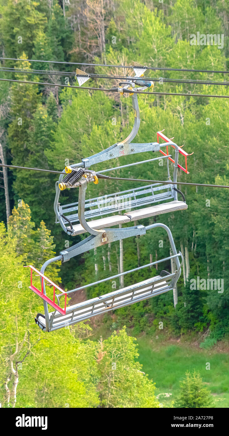 Vertical frame Chairlifts with aerial view of ski resort covered in