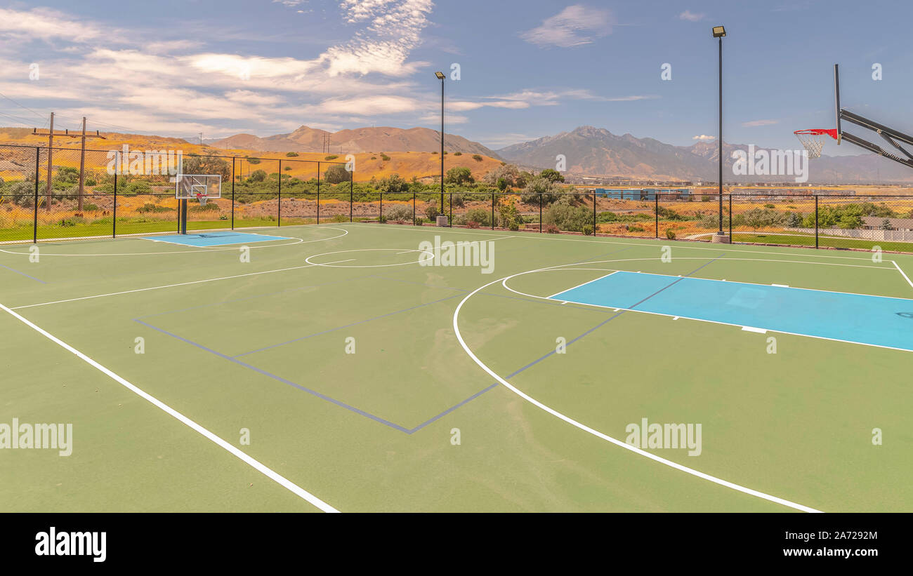 Panorama frame Outdoor turf basketball court on sunny, clear day Stock  Photo - Alamy