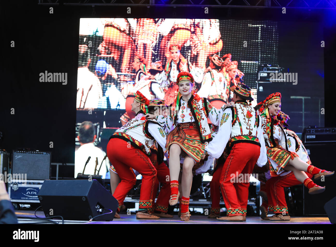 Ukrainian youth people in national costumes take part in the Montreal Ukrainian Festival. Artistic groups of dancers from Ukraine and Canada present a Stock Photo