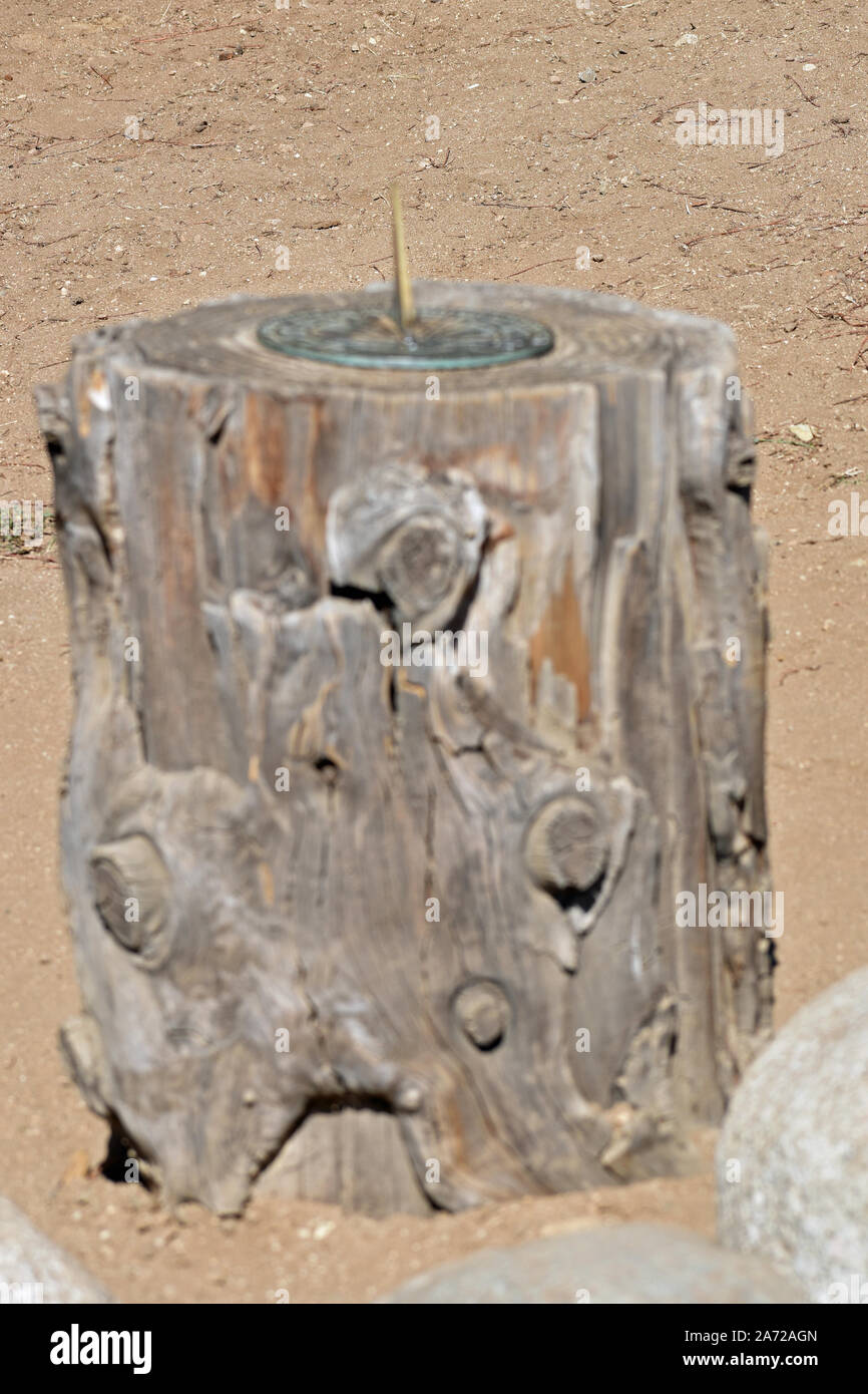 Sun Dial on a Stump Stock Photo
