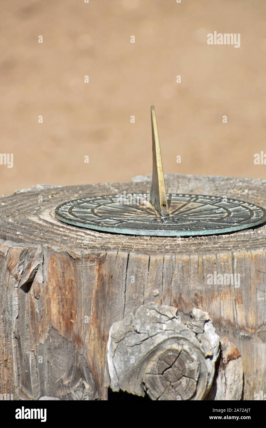 Sun Dial on a Stump Stock Photo