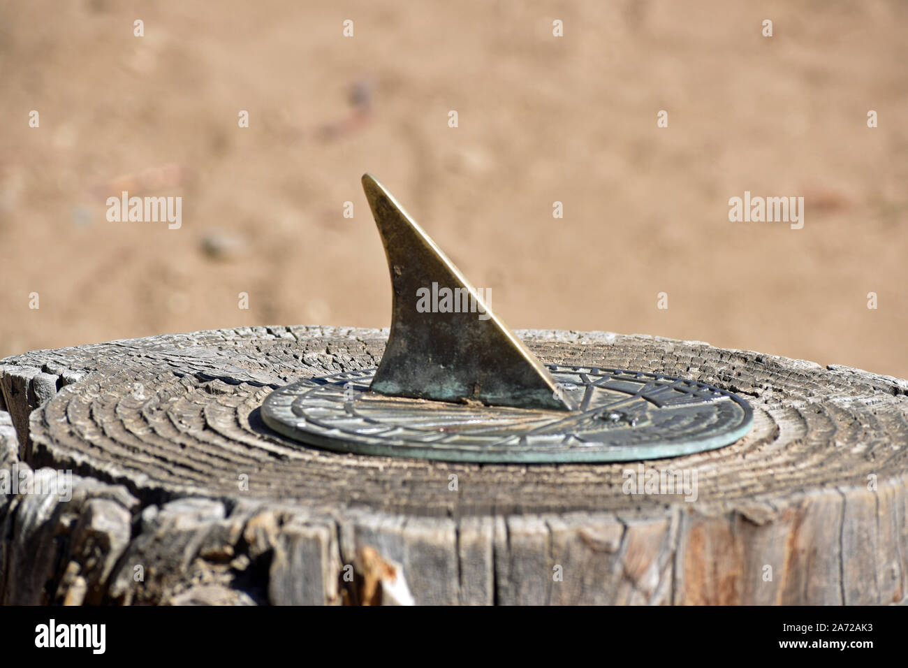 Sun Dial on a Stump Stock Photo