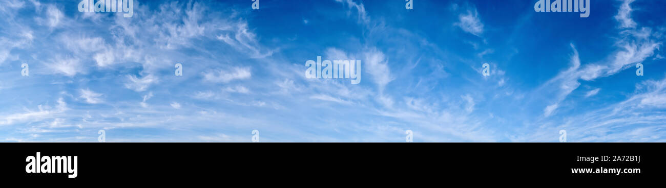 Panorama of a blue sky with white clouds as a backround Stock Photo