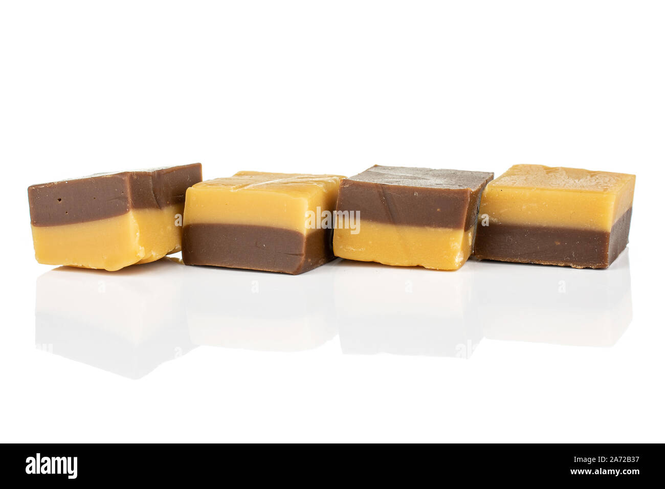 Group of four whole sweet brown caramel chocolate candy isolated on ...